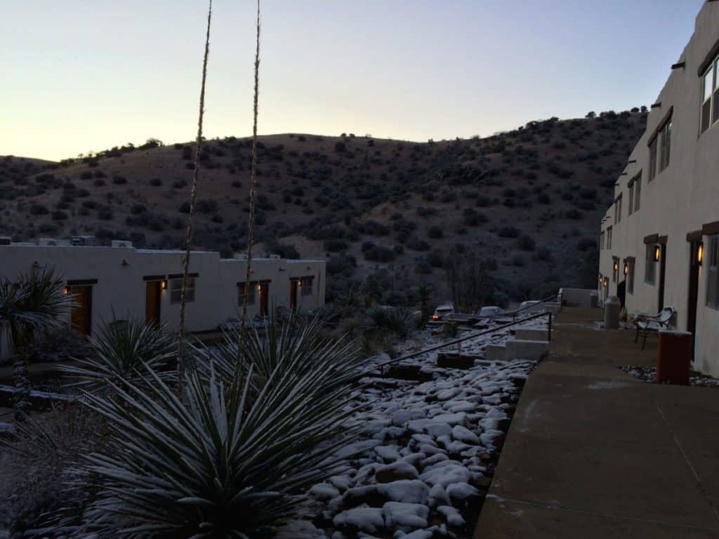 An over-night snow shower paints the desert in white at the Indian Lodge in Davis Mountains State Park. West Texas Road trip with kids, 