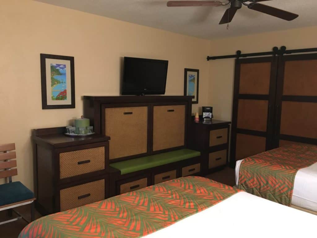 The interior of the Caribbean Beach Resort with the TV, coffee maker and trundle-hiding credenza. Caribbean Beach Resort, Walt Disney Resort, 