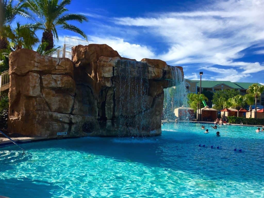 A water slide and waterfall at the pool keeps kids busy. 