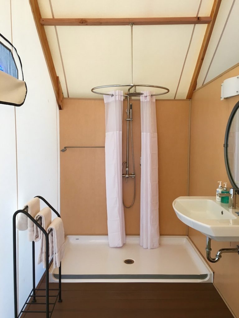 Enjoy a hot shower in the canvas cottage at Lakedale Resort, the best place to camp with kids in Washington. 