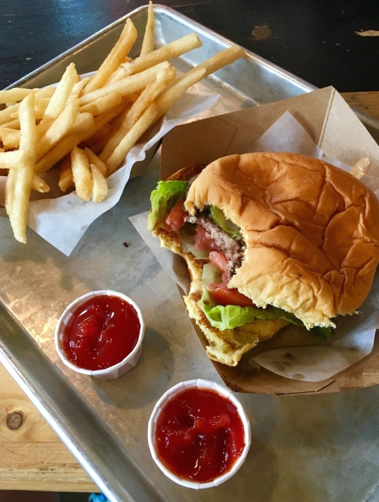 Where to eat in NYC with teens, a burger at Genuine Roadside Burger. 