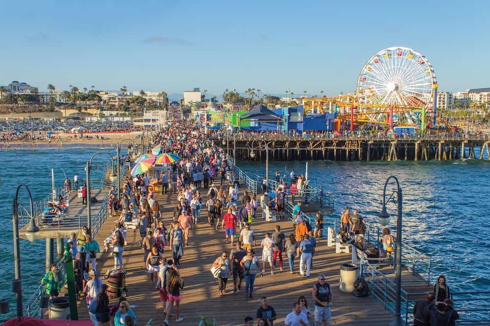 Walk along Santa Monica Pier, where to go in LA with kids. 