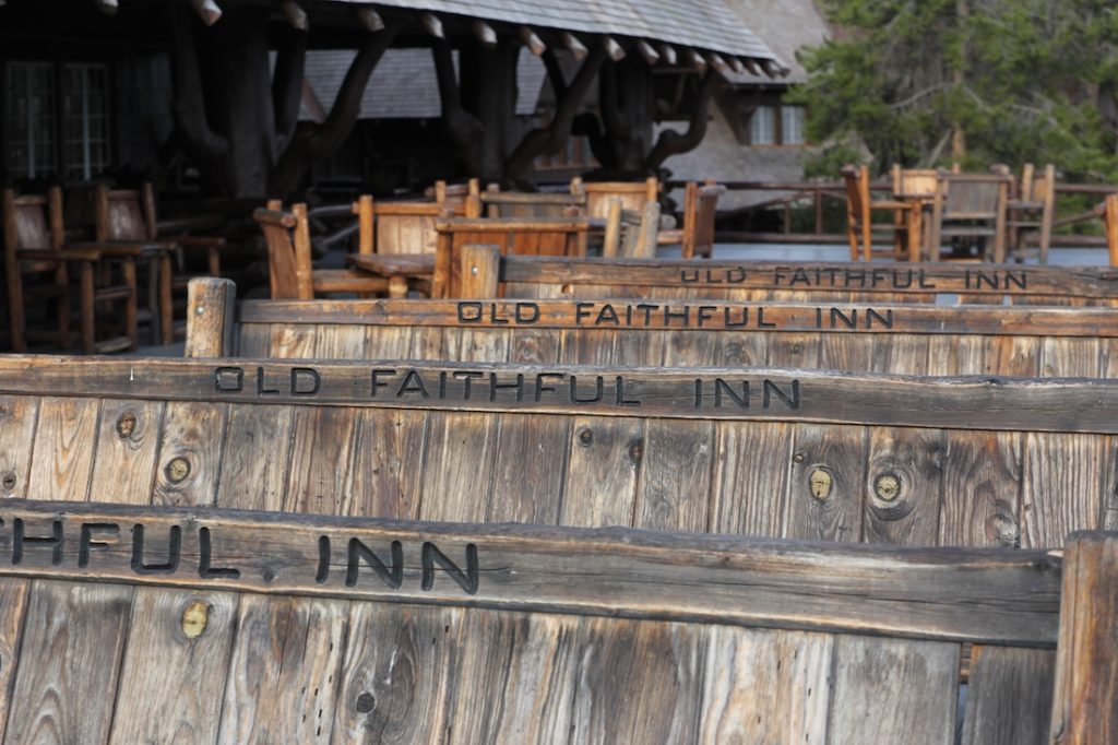 The bench of Old Faithful Inn. Old Faithful Inn with kids.