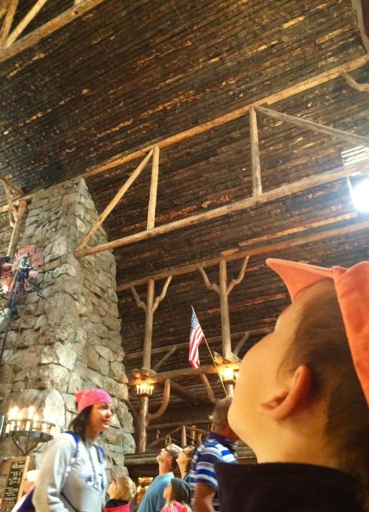 See the towering timbers in Old Faithful Inn. 