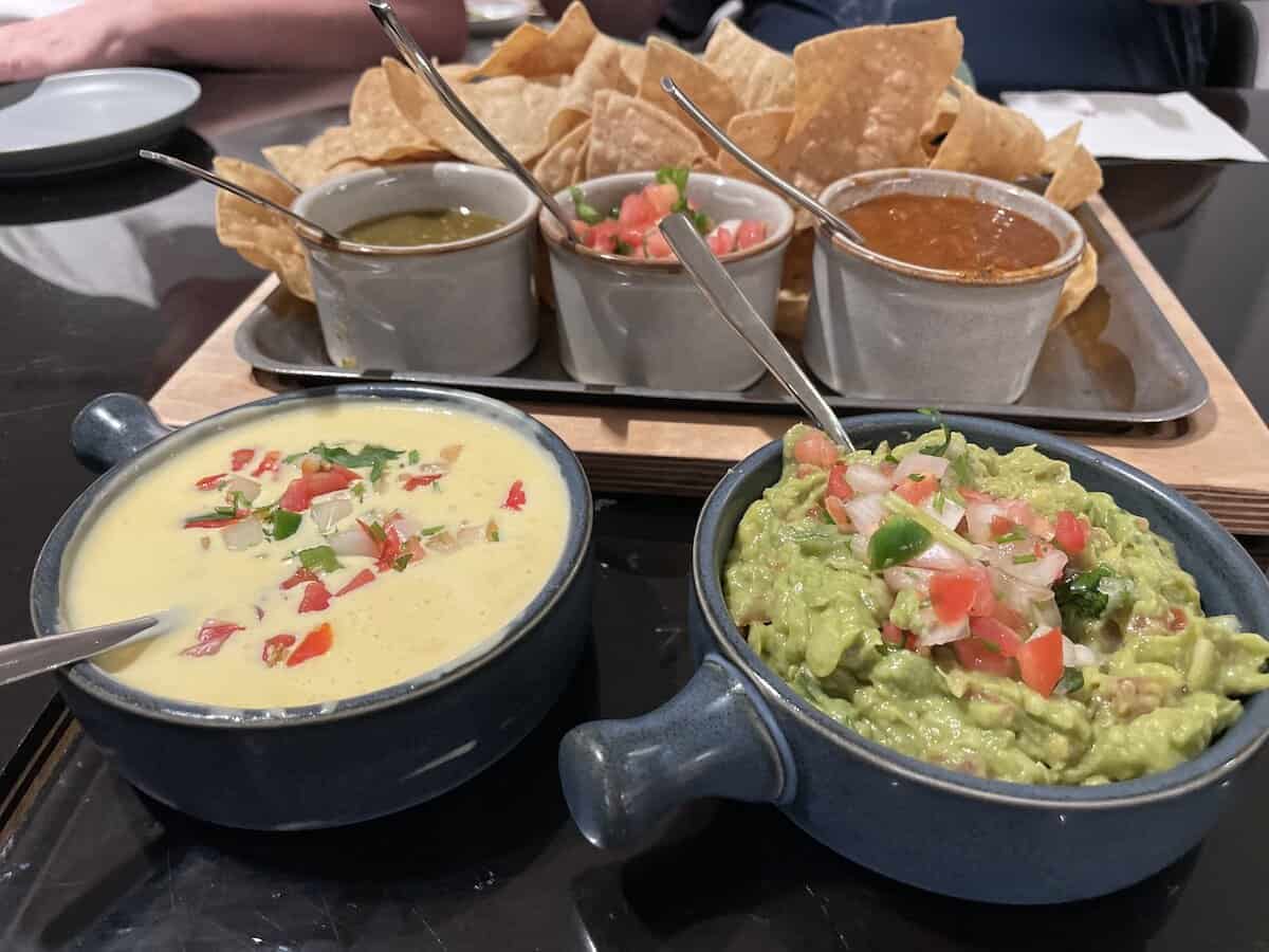 Chips and queso with guacamole 