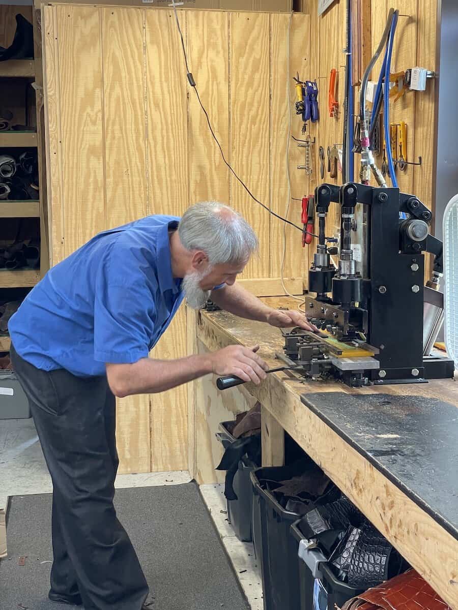 Loren Yoder crafts a belt at his shop: Silver Star Leather